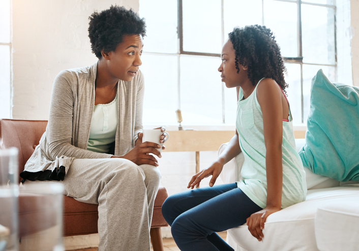 woman talking with a young girl